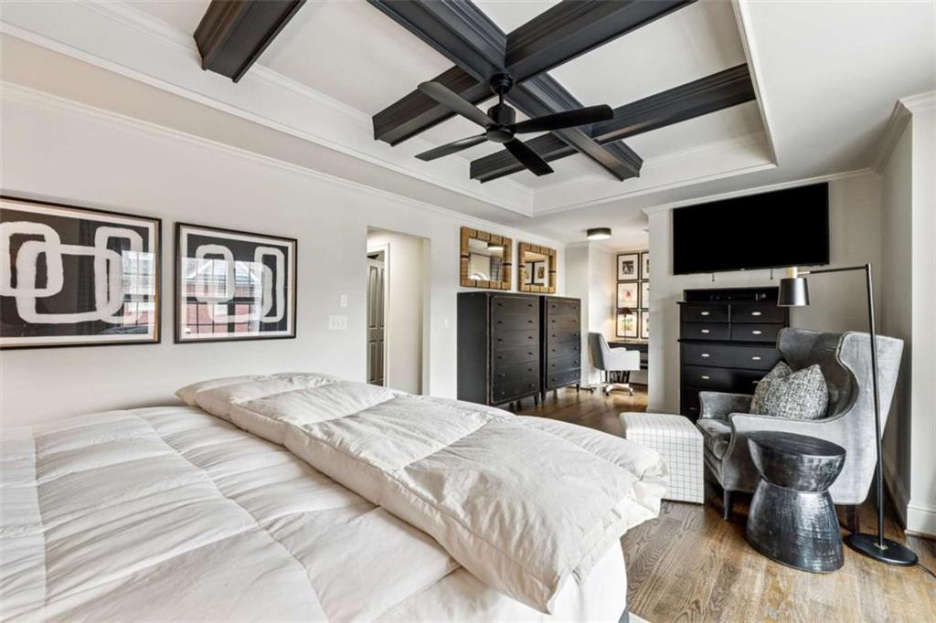 10296 Quadrant Court Alpharetta, GA 30022 - Photo 15 of 28 a bedroom with a bed furniture and a flat screen tv