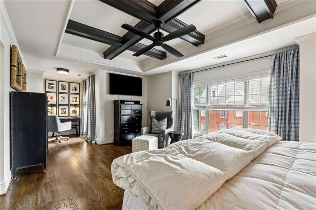 10296 Quadrant Court Alpharetta, GA 30022 - Photo 16 of 28 a bed room with a bed a television and a large window