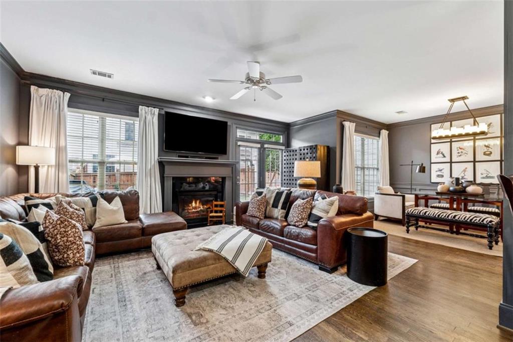 10296 Quadrant Court Alpharetta, GA 30022 - Photo 6 of 28 a living room with furniture fireplace and flat screen tv