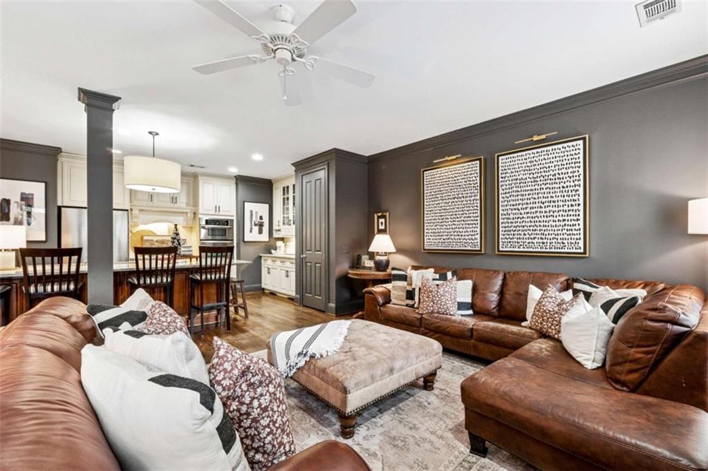 10296 Quadrant Court Alpharetta, GA 30022 - Photo 7 of 28 a living room with furniture and a large window