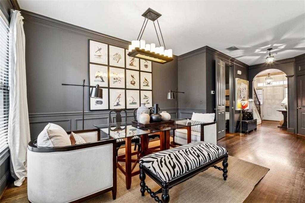 10296 Quadrant Court Alpharetta, GA 30022 - Photo 10 of 28 a living room with furniture and a chandelier