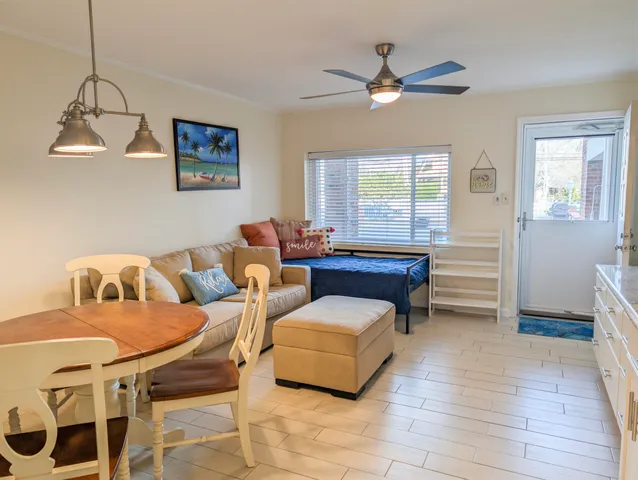 a living room with furniture and a window