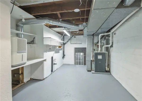 a utility room with cabinets dryer and washer