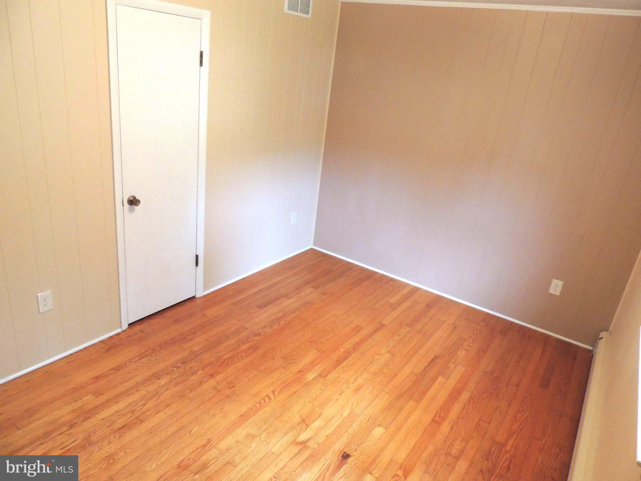 5838 Oklahoma Road Sykesville, MD 21784 - Photo 49 of 72 Spacious room with warm wooden floors.