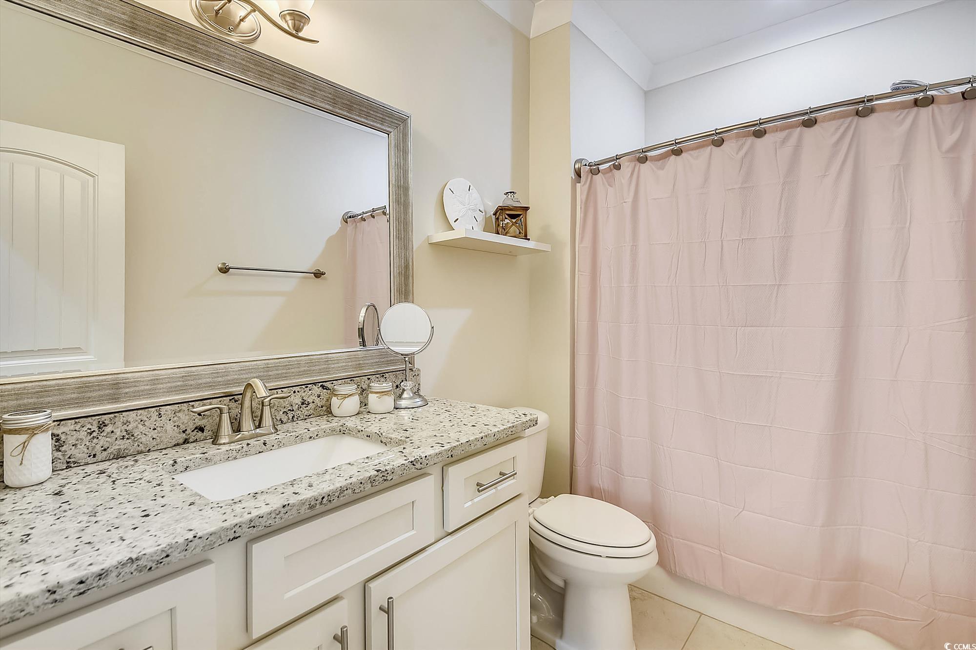 1029 Ray Costin Way, Unit VILLA 906 Murrells Inlet, SC 29576 - Photo 21 of 40 Bathroom featuring toilet, vanity, a shower with curtain, and tile patterned flooring