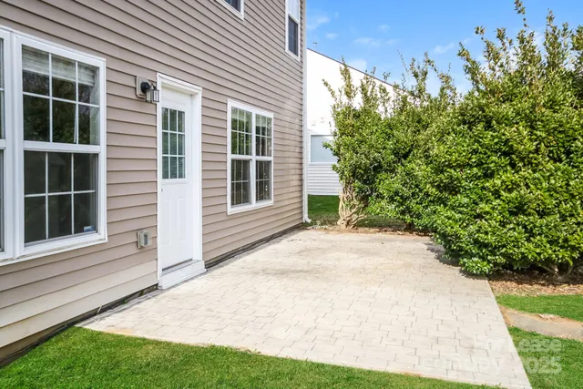 a view of backyard with a garden and plants