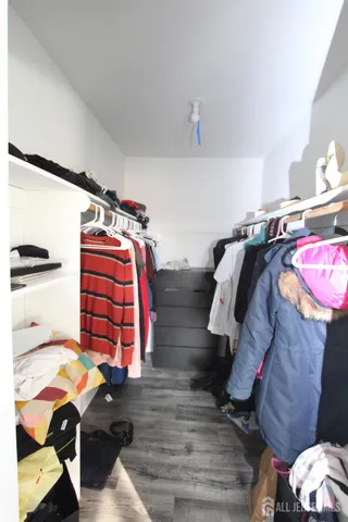 a bedroom with a bed and a closet