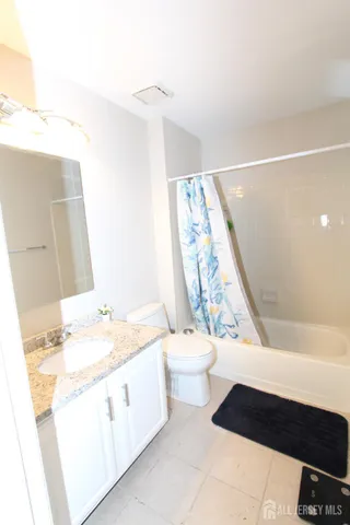 a bathroom with a sink a toilet and a bathtub