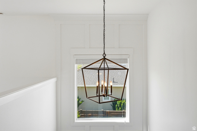 338 Windy Rdg Drive Smithfield, UT 84335 - Photo 20 of 63 Geometric chandelier illuminating a window with board and batten wall detailing
