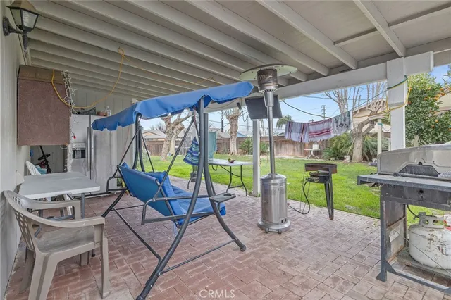 a view of a chairs and table in the patio