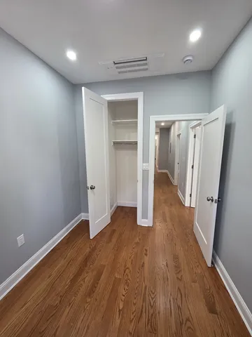 a view of entryway with wooden floor
