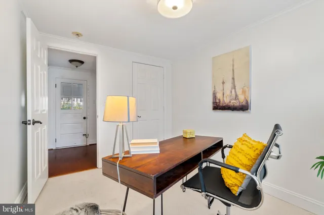 a room that has a table and a chair in it