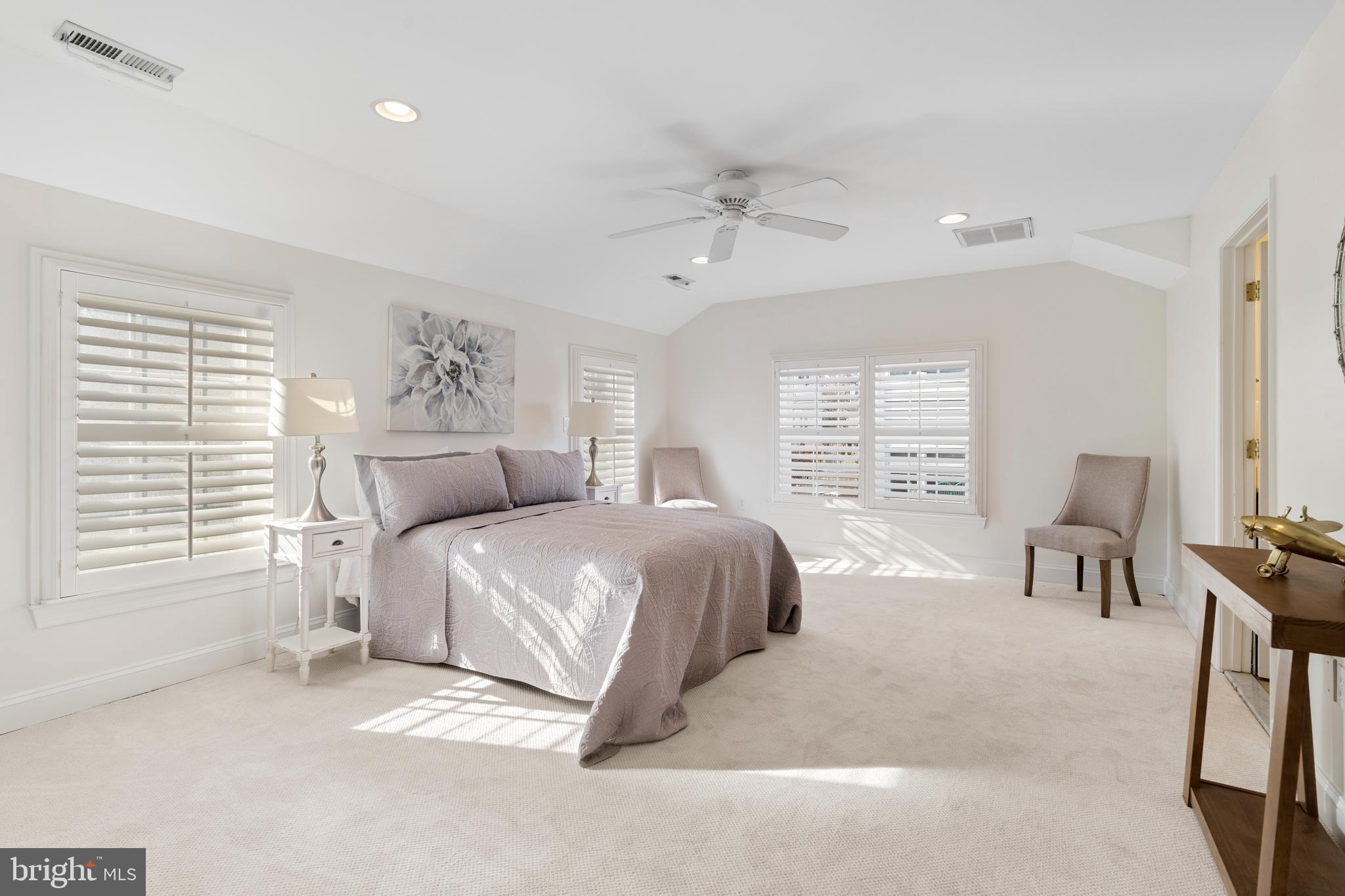 310 Worthington Road Baltimore, MD 21286 - Photo 21 of 50 a spacious bedroom with a bed a chair and a large window