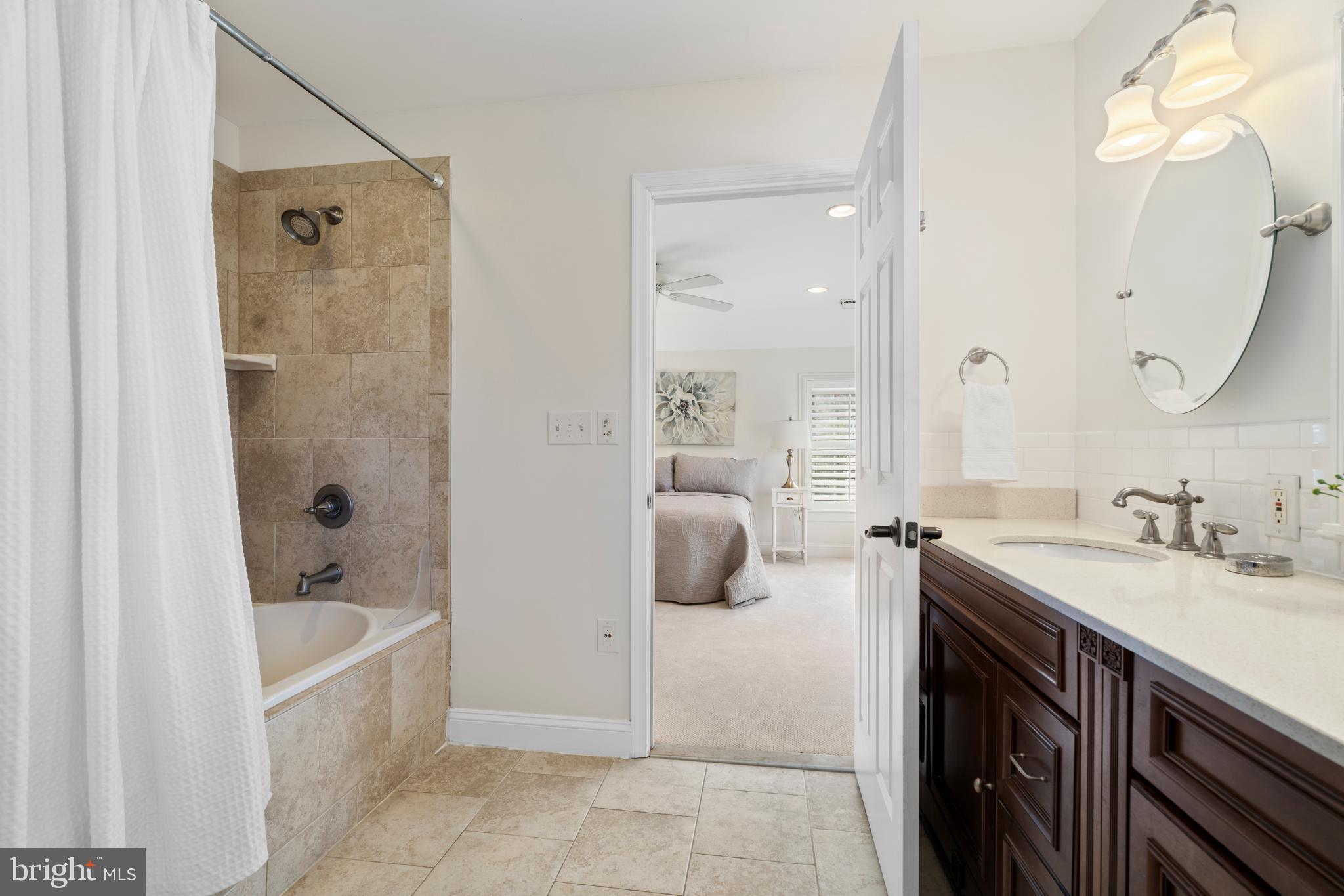 310 Worthington Road Baltimore, MD 21286 - Photo 24 of 50 a bathroom with a tub sink and mirror