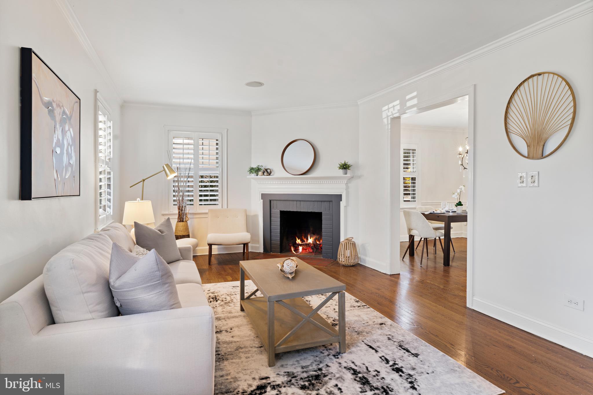 310 Worthington Road Baltimore, MD 21286 - Photo 3 of 50 a living room with furniture a mirror and a fireplace