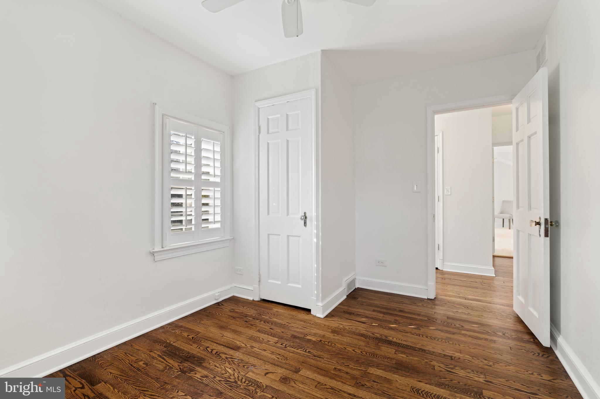310 Worthington Road Baltimore, MD 21286 - Photo 32 of 50 a view of an empty room with wooden floor and a window