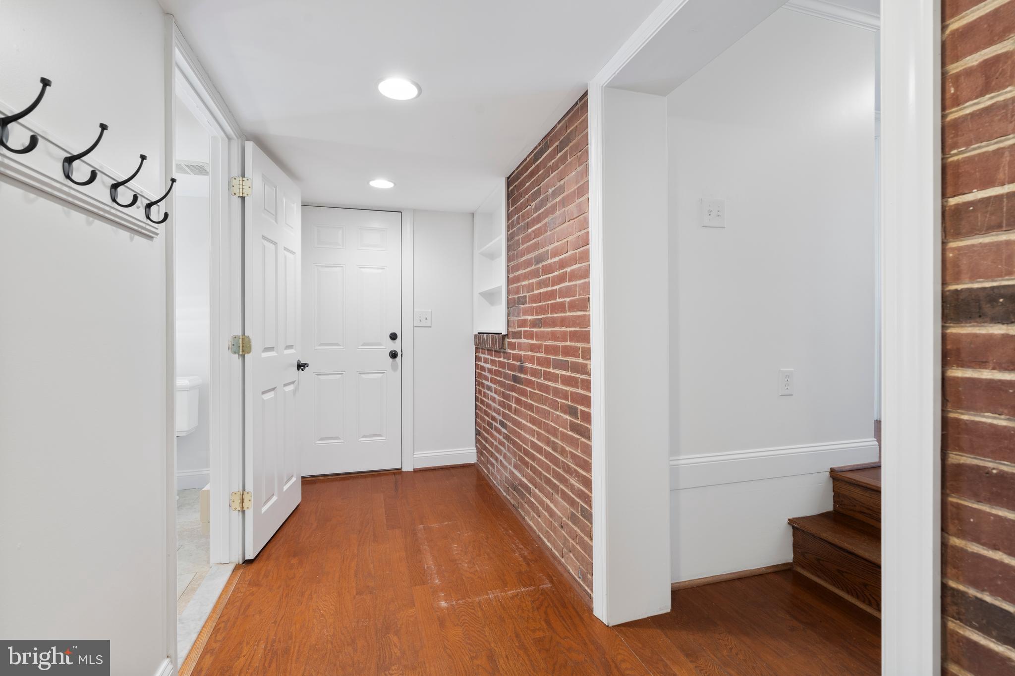 310 Worthington Road Baltimore, MD 21286 - Photo 40 of 50 a view of a hallway with wooden floor and staircase