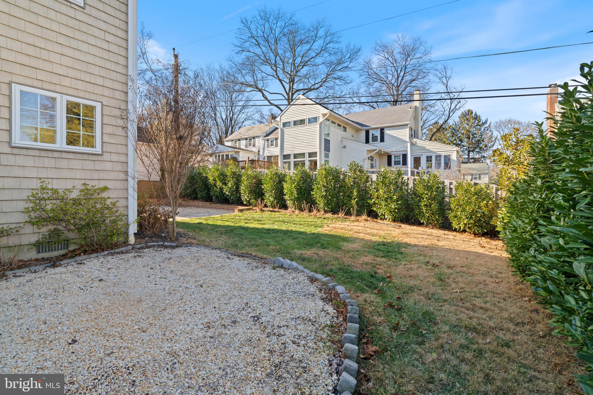 310 Worthington Road Baltimore, MD 21286 - Photo 44 of 50 a view of a white house next to a yard with big trees