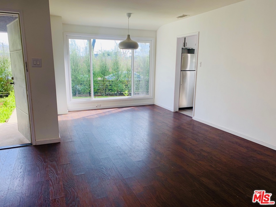 2555 Walnut Avenue Venice, CA 90291 - Photo 4 of 9 a view of a hardwood floor in an empty room with a window