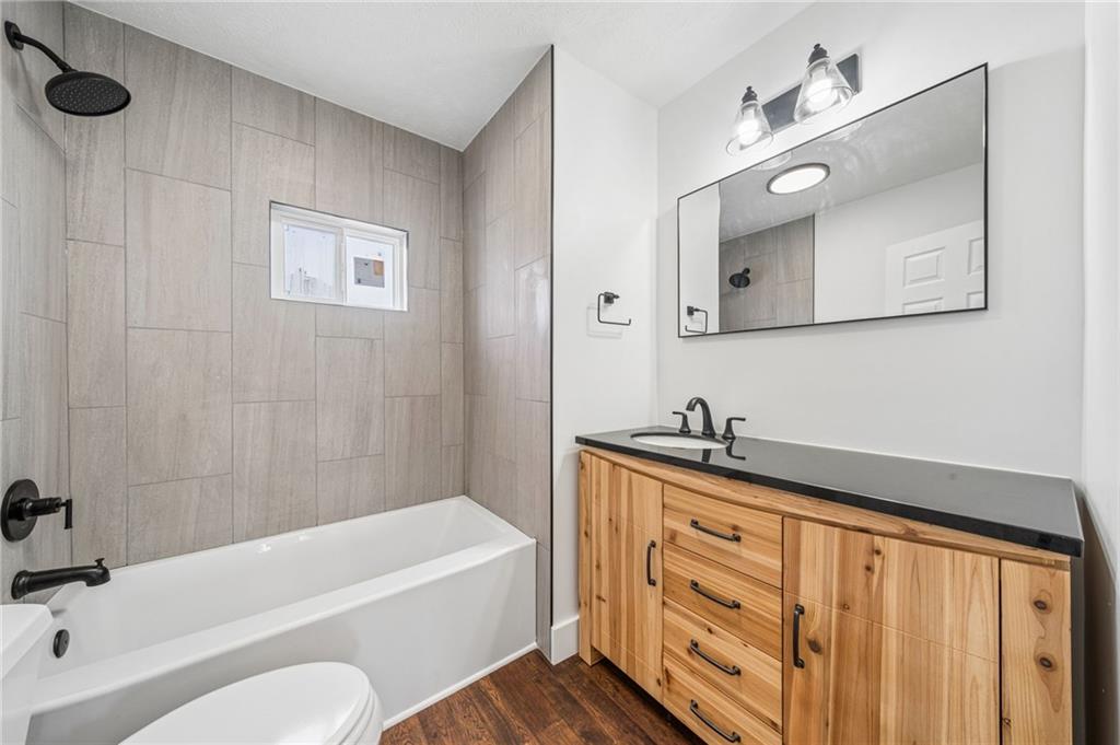 363 Oak Spring Road Canonsburg, PA 15317 - Photo 18 of 35 a bathroom with a granite countertop sink a toilet and bathtub