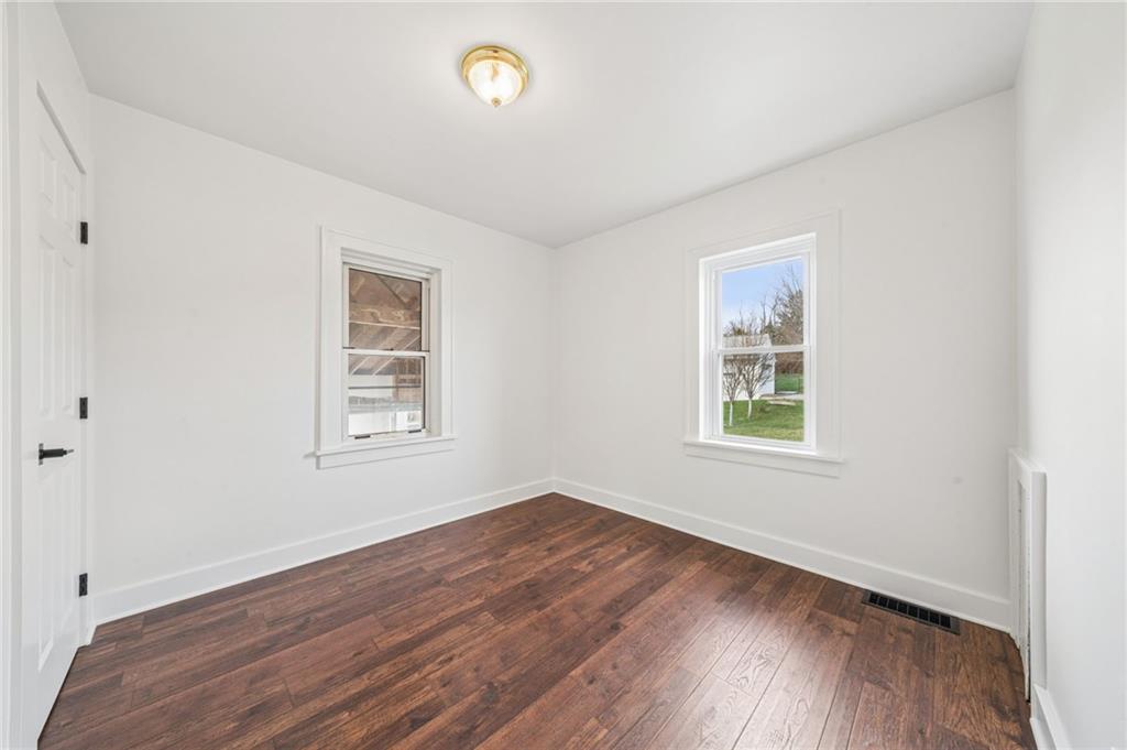 363 Oak Spring Road Canonsburg, PA 15317 - Photo 19 of 35 an empty room with wooden floor and windows
