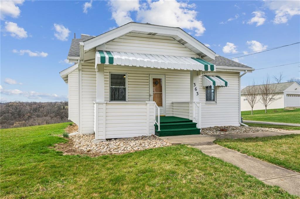 363 Oak Spring Road Canonsburg, PA 15317 - Photo 2 of 35 a front view of a house with a yard