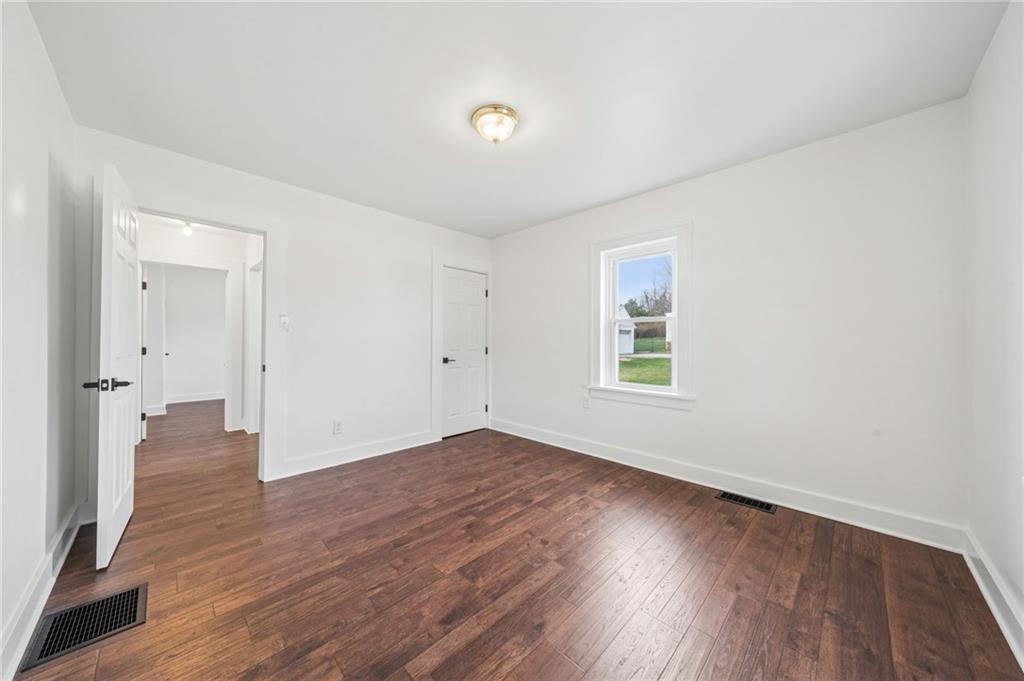363 Oak Spring Road Canonsburg, PA 15317 - Photo 23 of 35 an empty room with wooden floor and windows