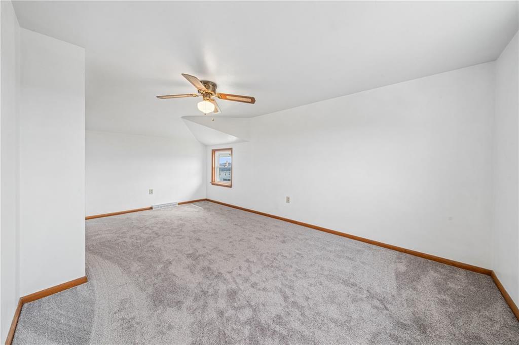 363 Oak Spring Road Canonsburg, PA 15317 - Photo 30 of 35 an empty room with a chandelier fan and windows