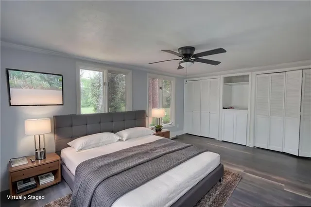 a bedroom with bed and a chandelier