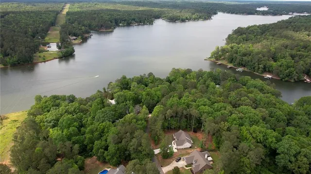 a view of a lake with green space