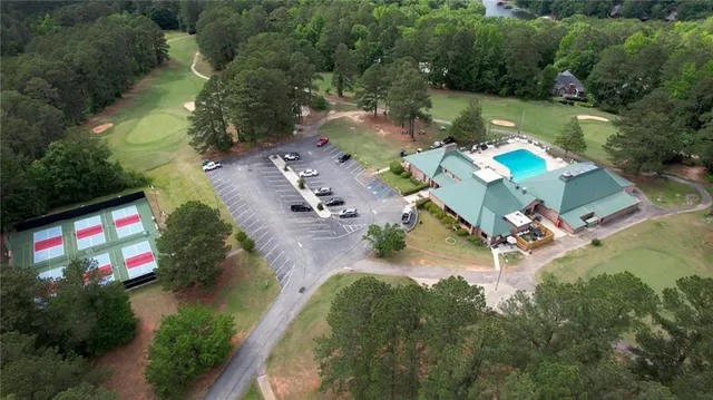 an aerial view of a house with yard swimming pool and outdoor seating