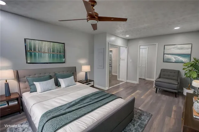 a bedroom with bed and a couch