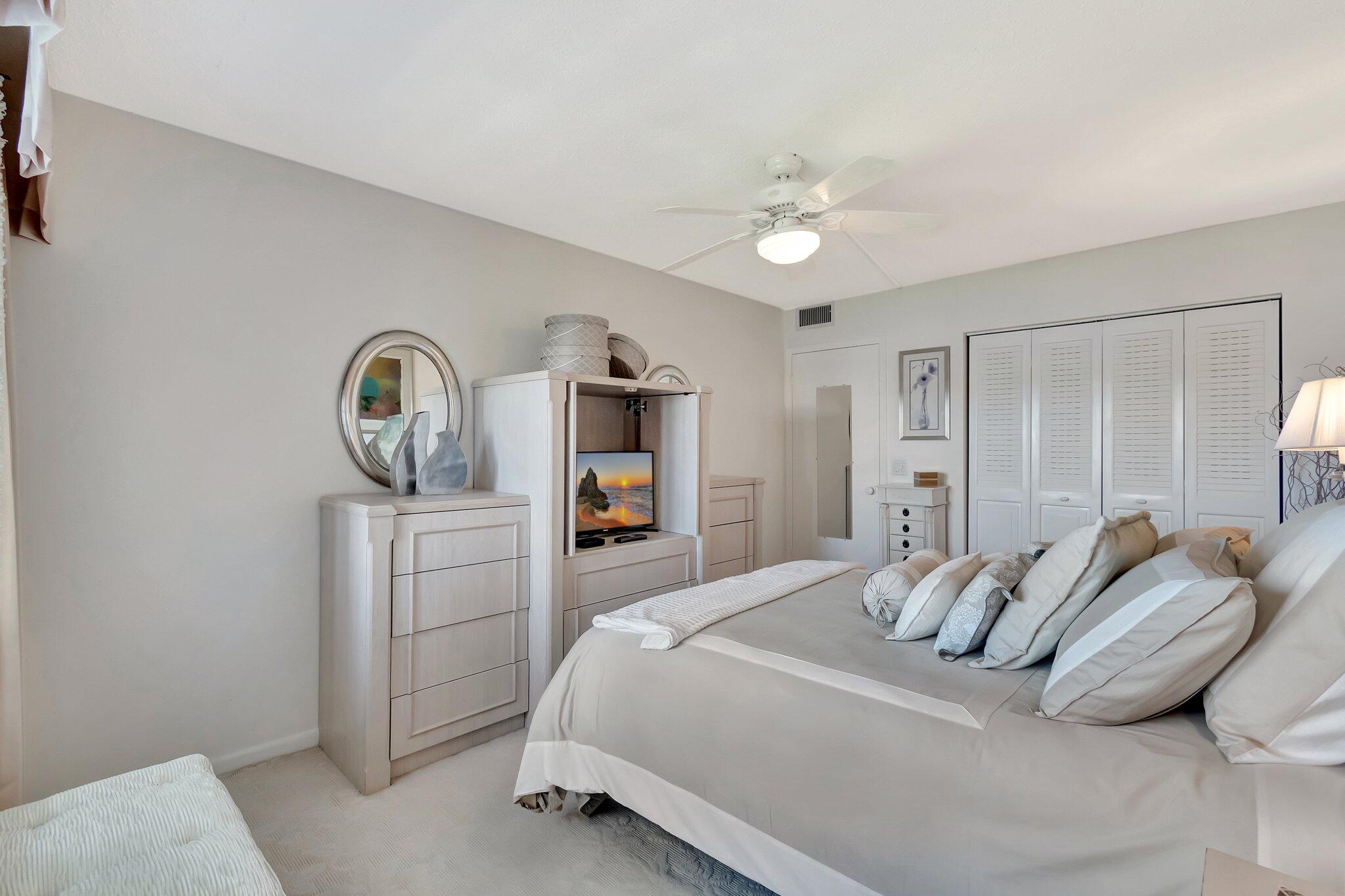 2026 Cornwall East Boca Raton, FL 33434 - Photo 25 of 82 a bedroom with a bed and a dresser