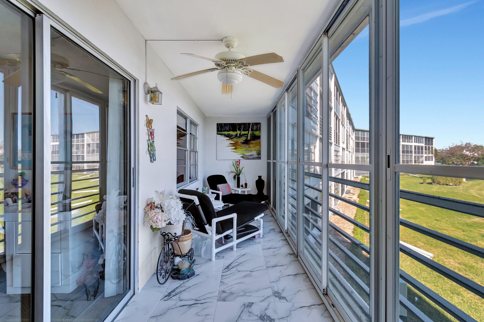 2026 Cornwall East Boca Raton, FL 33434 - Photo 34 of 82 a view of living room with furniture and a floor to ceiling window