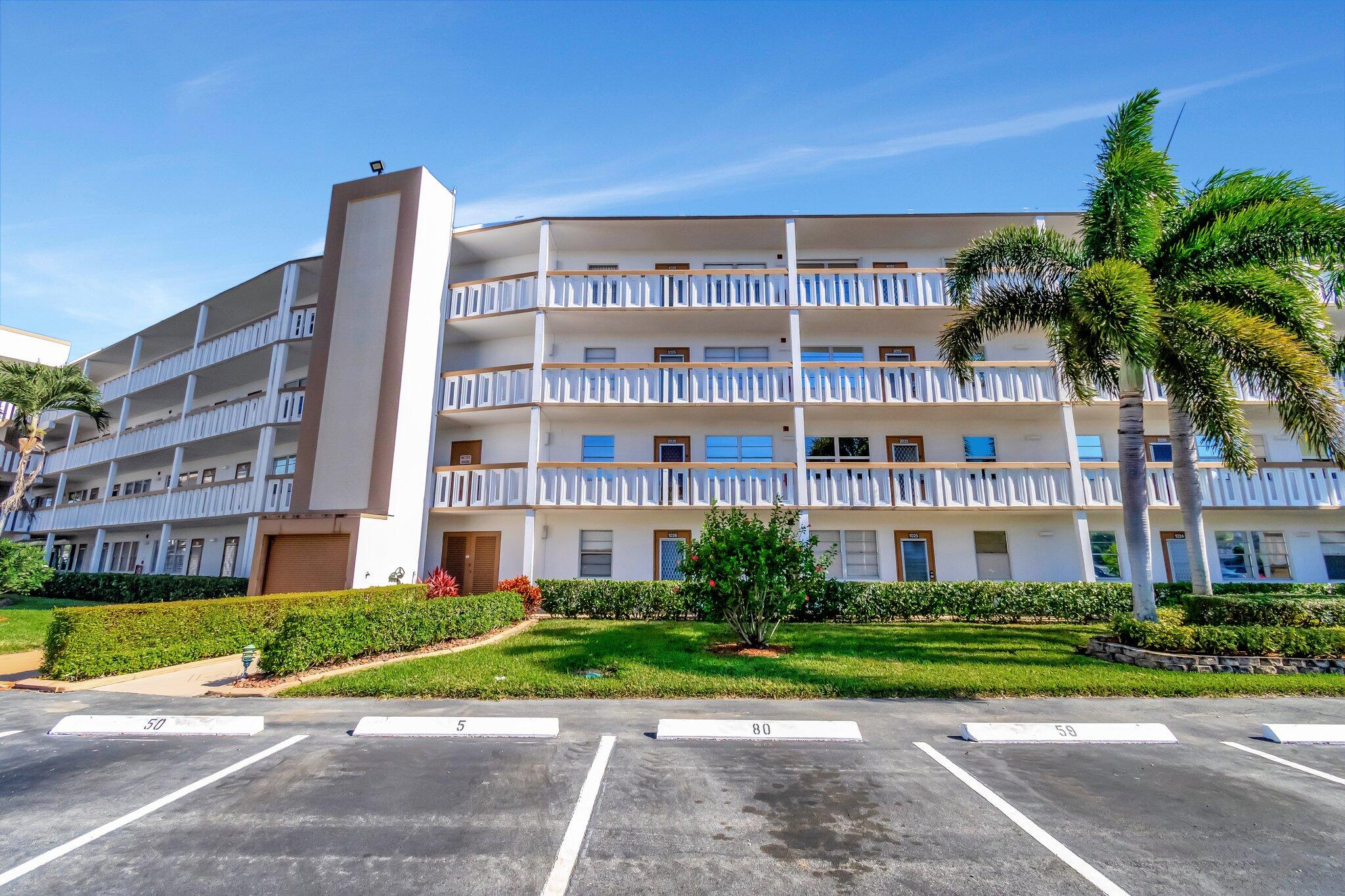 2026 Cornwall East Boca Raton, FL 33434 - Photo 4 of 82 a view of a building with a yard