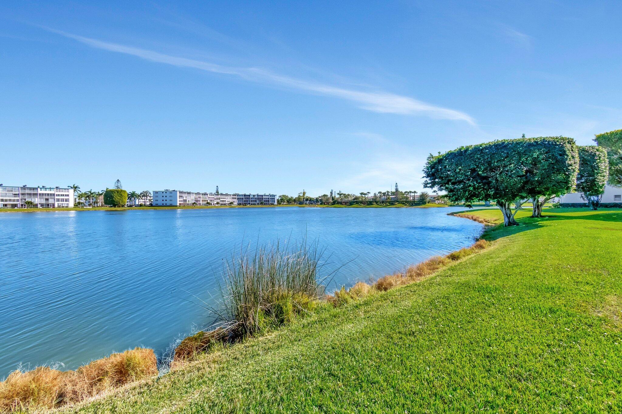 2026 Cornwall East Boca Raton, FL 33434 - Photo 41 of 82 a view of a lake with houses in the back