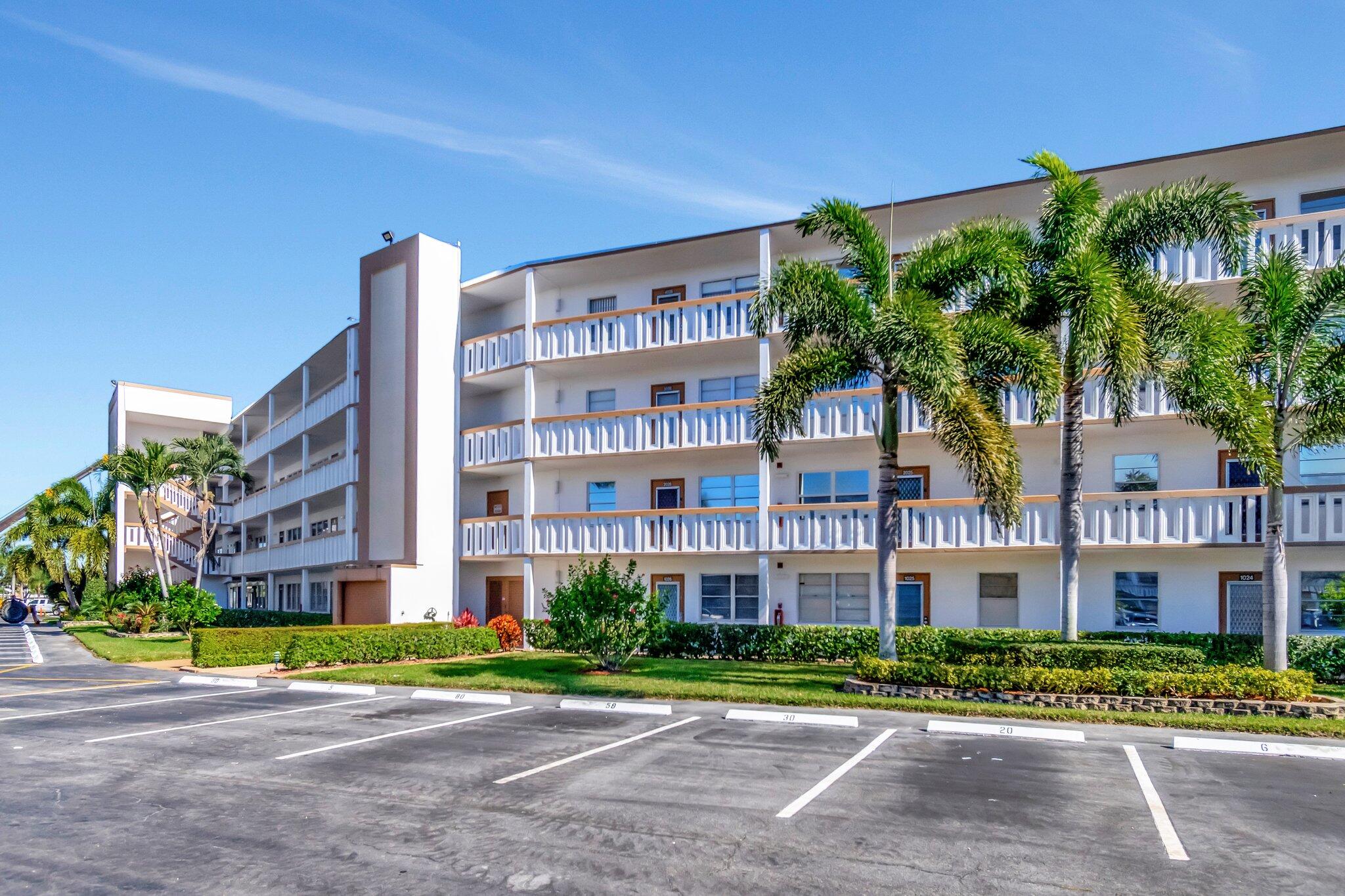 2026 Cornwall East Boca Raton, FL 33434 - Photo 6 of 82 a view of a building with a yard