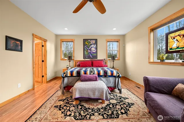 a bedroom with furniture and window