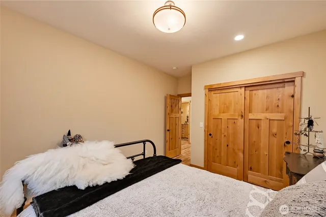 a bedroom with a bed and a dresser