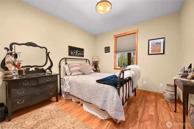 a bedroom with a bed and a dresser