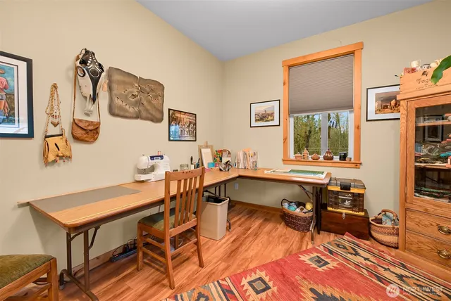 a view of a workspace with furniture and a livingroom