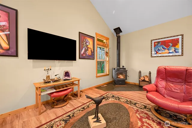 a bedroom with furniture and a flat screen tv