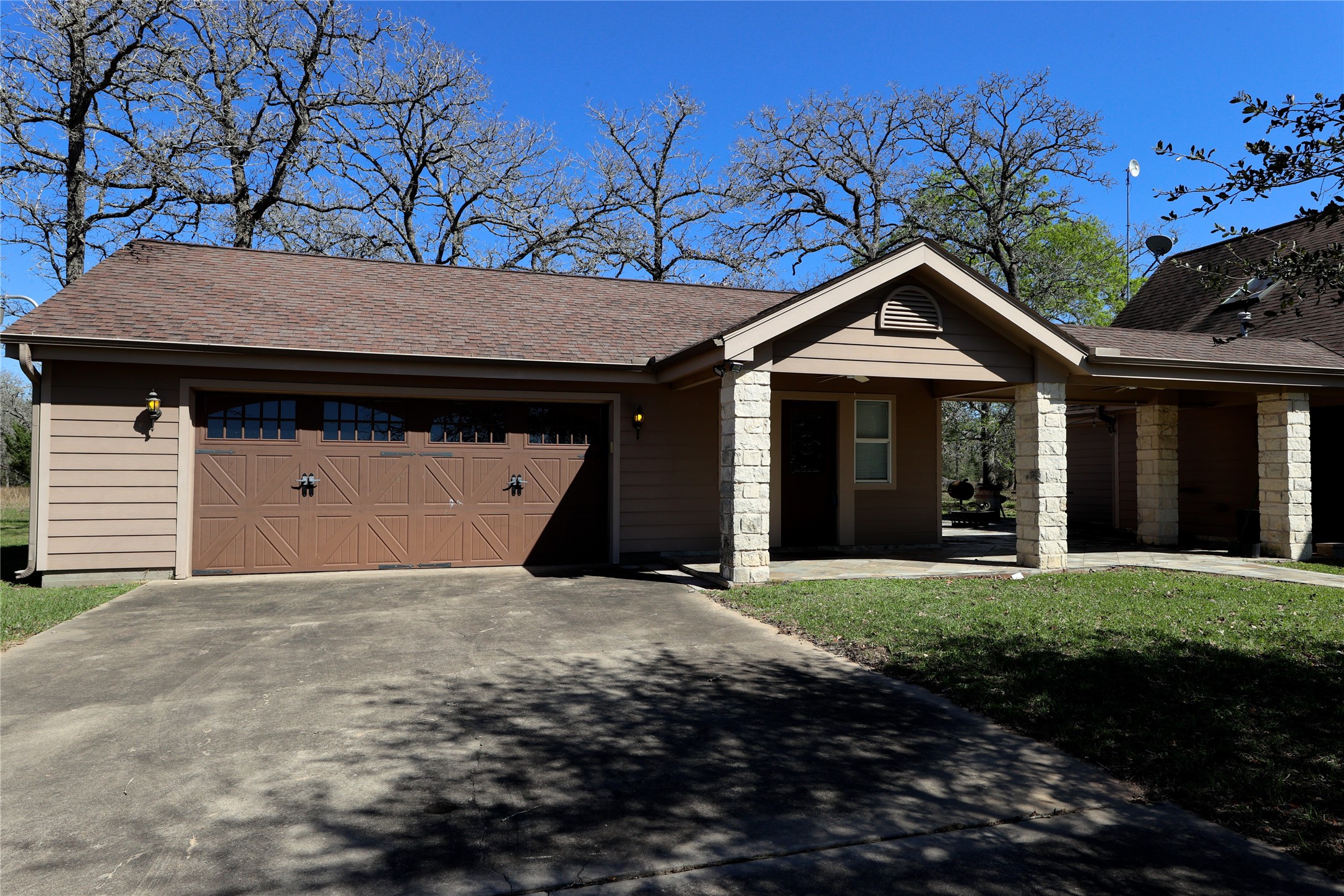 3337 Brunes Mill Road Columbus, TX 78934 - Photo 35 of 48 a front view of a house with a garden and yard