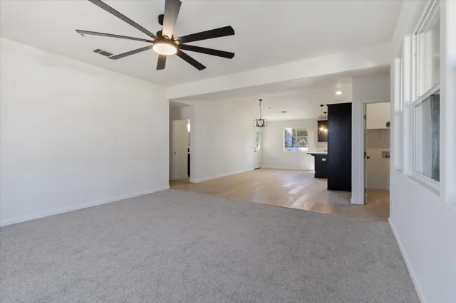 a view of an empty room and closet area