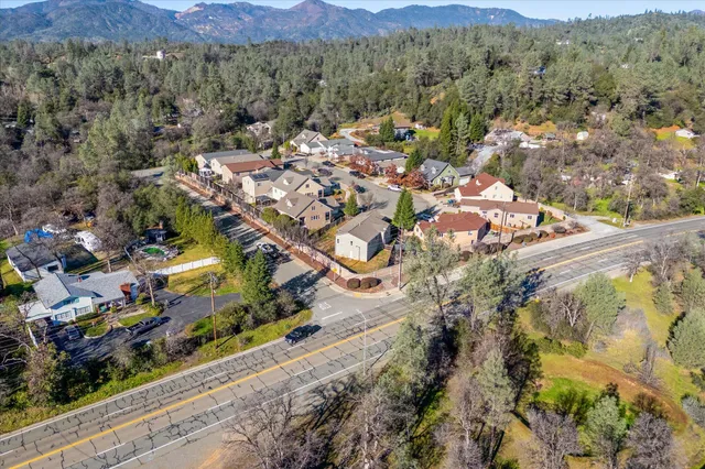 a view of living room with furniture and wooden floor