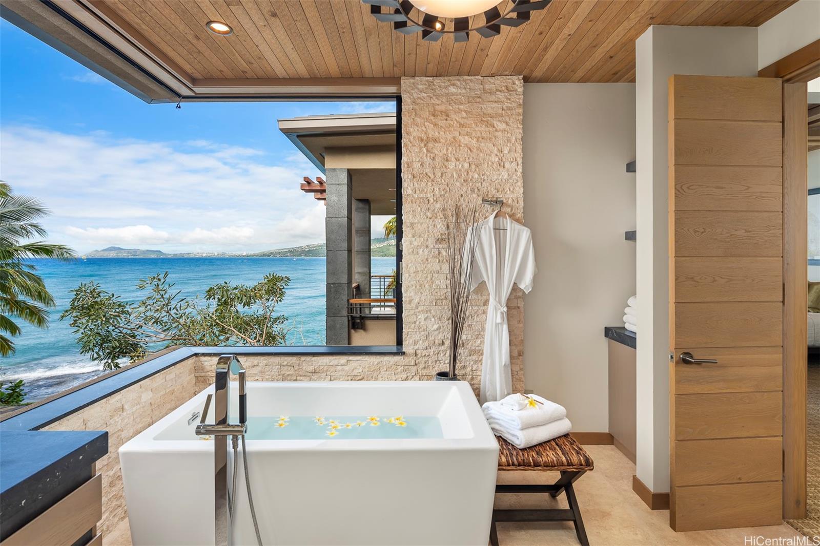 176 Hanapepe Loop Honolulu, HI 96825 - Photo 18 of 25 a bathroom with a sink and a large mirror