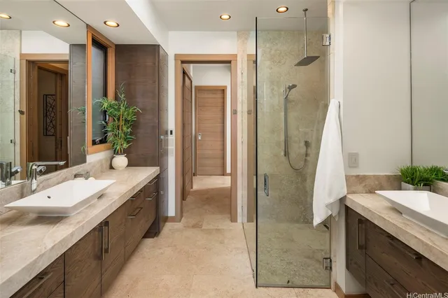 a spacious bathroom with a double vanity sink shower and a mirror