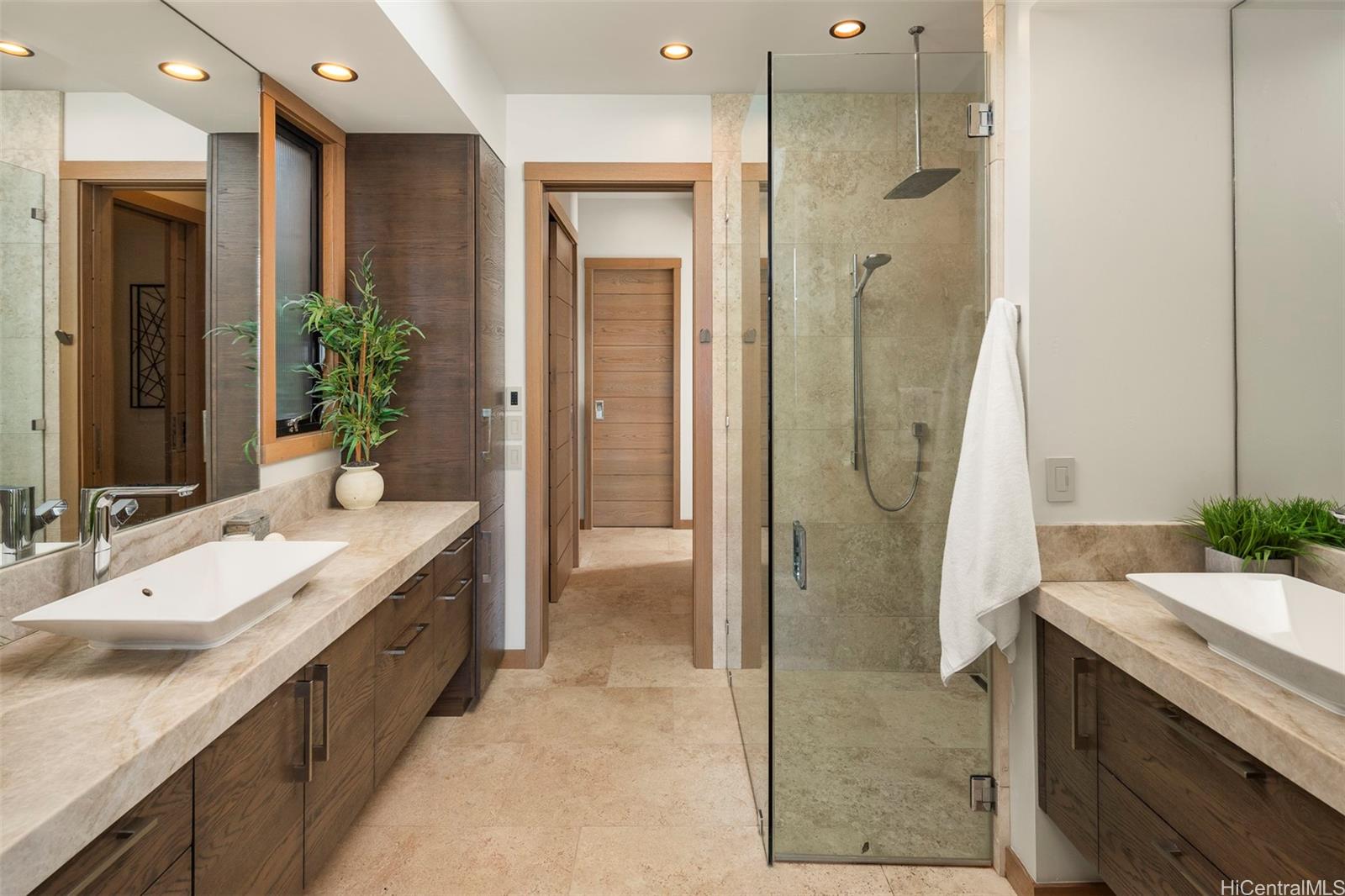 176 Hanapepe Loop Honolulu, HI 96825 - Photo 21 of 25 a spacious bathroom with a double vanity sink shower and a mirror