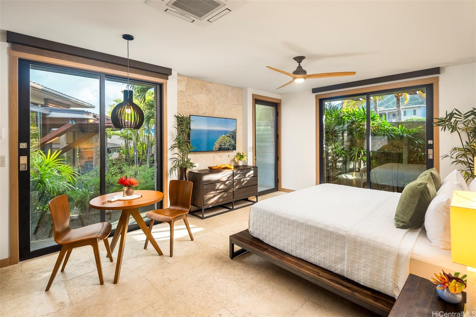 176 Hanapepe Loop Honolulu, HI 96825 - Photo 23 of 25 a bedroom with a bed and large windows