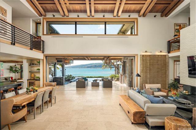 a lobby with furniture and floor to ceiling window